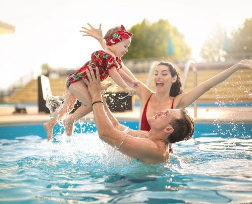Family in vacation rental swimming pool