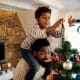 Airbnb Holiday Pricing - father with his son decorating