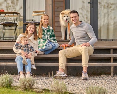 dog with family on porch