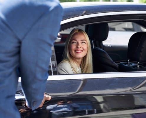 woman likes customer service in a private taxi