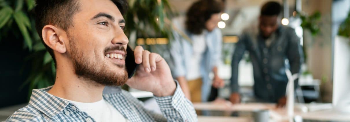 close-up-smiley-man-talking-phone