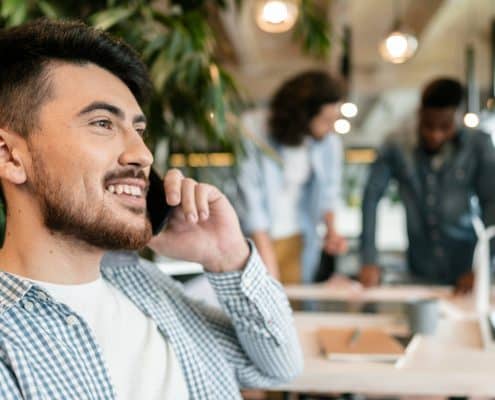 close-up-smiley-man-talking-phone