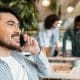 close-up-smiley-man-talking-phone